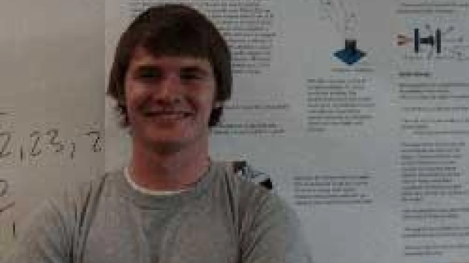 Edward McCary in front of his poster