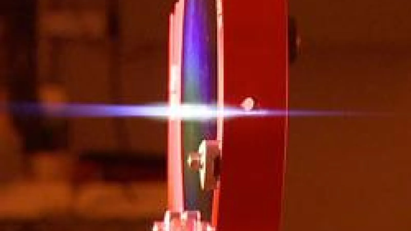 Side view of mirror reflecting a pulse of light