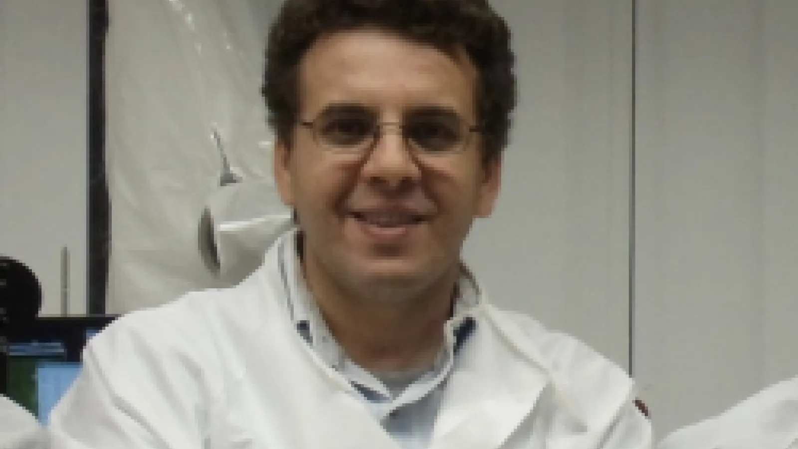 Dr. Kramer Akli in lab coat
