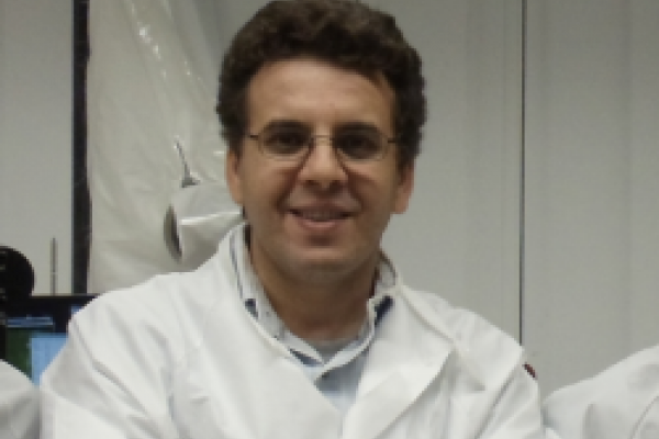 Dr. Kramer Akli in lab coat